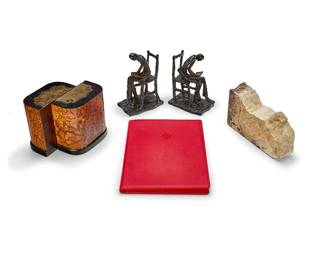 1059
A group of bookends and a Ferrari notebook
Late 20th/early 21st century
Comprising a pair of patinated metal bookends in the form of seated figures reading, a pair of burlwood and composite bookends, a single petrified wood specimen bookend, and a red leather Ferrari notebook
6 pieces
Each figure: 8" H x 3.75" W x 6" D; Notebook: 12.25" H x 9" W x 0.875" D
Estimate: $200 - $300