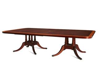 1258
A George III-style mahogany and satinwood dining table
20th century
The dining table raised on twin pedestals, each issuing four curvilinear fluted legs terminating in brass casters
32" H x 120.5" W x 72" D
Estimate: $400 - $600