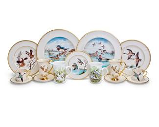 1255
An Abercrombie & Fitch porcelain part dinner service
20th century
Each with red printed retailer's mark; the porcelain probably by Pickard; the plates signed: F. [Frank] Vosmansky; the cups signed: Cyril Gorainoff; or with initials: F.V.; the Flintridge saucers with green printed factory marks; St. George with black printed factory marks
Each decorated with game birds, comprising nine 10.5" dinner plates, ten 8.25" salad plates, ten 6.5" bread and butter plates, and twelve demitasse cups with saucers, together with a Flintridge porcelain Irish coffee service, in the 'Game Birds' pattern, comprising eight coffee cups and eleven saucers, and six St. George mugs decorated with birds with black painted titles
78 pieces
Estimate: $300 - $500