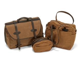 1285
A group of Filson leather and canvas bags
Late 20th/21st century
Each with retail tags
Each in tan cotton twill with leather straps and handles, comprising a carry-on bag (no. 242) and a tote bag (no. 261), as well as a small 'Dopp kit' travel bag
3 pieces
Carry-on: 13" H x 19" W x 8.5" D; Tote: 12.5" H x 15" W x 6" D
Estimate: $300 - $500