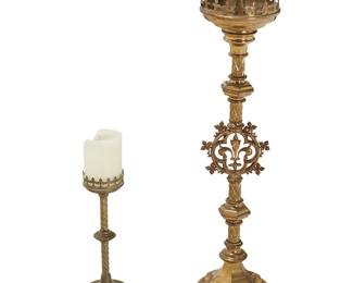 1211
Two Continental brass candlesticks
19th/20th century
Pricket inscribed: F. Brondel / Bulcke Bruges / 1871
Comprising a tall brass pricket stick with fleur-de-lis decoration to the upper gallery and at the center of the stem, and a brass candlestick with a gallery top, twisted stem, and claw feet
2 pieces
Pricket: 40" H; Candlestick: 17" H
Estimate: $100 - $200