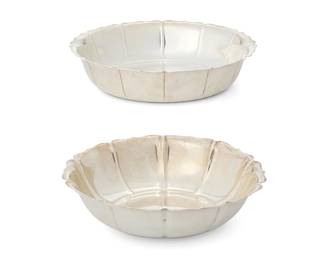 1016
Two American sterling silver scalloped bowls
Early/mid-20th century; Massachusetts
The first marked: from Early Dublin Design / circa 1720 / Lunt Sterling / 713-D; the other marked for Watson and: Sterling Silver / A408 / 9 / Exemplar circa 1728 / Irish
Comprising a Lunt silver 'Early Dublin Design' bowl and a Watson silver 'Irish Exemplar' bowl pattern number 858
2 pieces
Lunt: 1.875" H x 9" Dia.; Watson: 2" H x 9.25" Dia.
Total weight: 30.3 oz. troy approximately
Estimate: $500 - $700