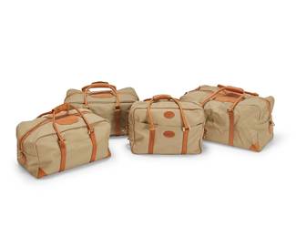 1089
A group of King's Ranch duffle bags
Late 20th/21st century
Each marked for maker
Comprising four beige canvas and leather bags in various sizes and styles, three with monogram to leather: RAD
4 pieces
Largest: 11" H x 21" W x 11.5" D ; Smallest: 11" H x 16" W x 5.5" D
Estimate: $300 - $500