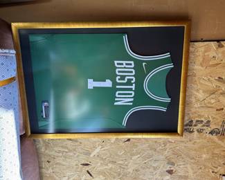 2 framed Celtics jackets