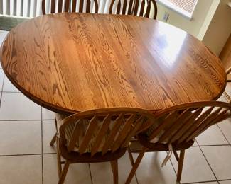 *PRE-SALE: Oak Kitchen Table is 65 inches long, 49 inches wide and 29 inches tall. It is oval with the 17 3/4 Leaf. Includes 4 Oak Chairs $225  There are 3 More Similar (But Different) Oak Chairs we are selling for $20 Each