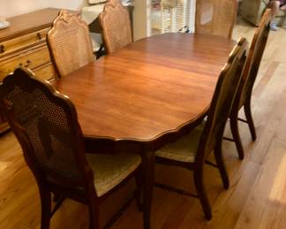 SOLD During PRE-SALE BASSETT FURNITURE Dining Room Set. The Beautiful Table has always been covered w Pads and is in Great Condition. The Table is oval-shaped, 80 inches long with one leaf that is18 inches long, 42 inches wide and 30 inches tall.
6 BASSETT Cane Back Chairs.
BASSETT Server / Buffet is 39 1/2 inches long,19 inches deep and 33 inches tall.
BASSETT China Cabinet is 58 inches wide, 16 inches deep and 79 1/2 inches tall. All 4 pieces SOLD
