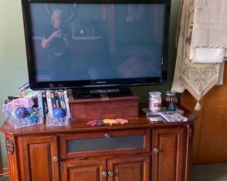 Several flat screen TV's and this entertainment center is a great fit for any room