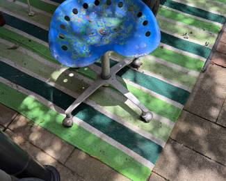 Antique Tractor seat on rolling office chair wheels