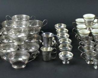 Collection of sterling cup/bowl frames, some undertrays, and some porcelain inserts. Approximately 66.0 troy oz weighable. Provenance: Methuen, Massachusetts estate. PLEASE NOTE: payment for silver, gold, jewelry, and coins must be made via wire transfer, cash, or certified bank check ONLY. The only exception is long-standing customers.