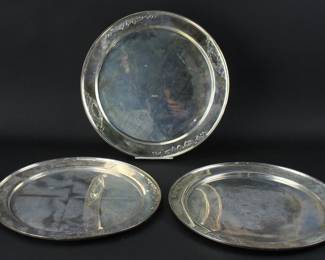 Set of (3) matching hand-chased sterling trays, 14" diameter. Approximately 63.2 troy oz TW. Provenance: Methuen, Massachusetts estate. PLEASE NOTE: payment for silver, gold, jewelry, and coins must be made via wire transfer, cash, or certified bank check ONLY. The only exception is long-standing customers.