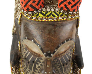 African mask, inlaid shells throughout, 23" x 11". Provenance: Hollywood, Florida collection.