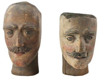 19th century Folk Art painted heads, lot of (2), 11" x 6" and 10" x 6". Provenance: Methuen, Massachusetts estate.