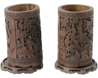 Two Chinese carved bamboo brush vases on wood stands, 6" x 3 1/2". Provenance: Methuen, Massachusetts estate.