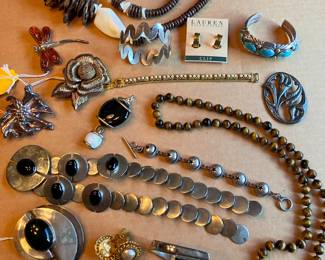 Plenty of costume and better jewelry (Sterling, Chanel) from around the world. This is a very small sample!