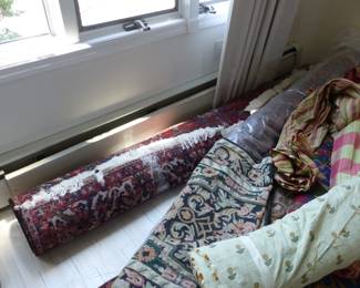 Sarouk and other area rugs, fabric bolts