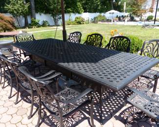Outdoor large cast aluminum dining table with 10 chairs & umbrella