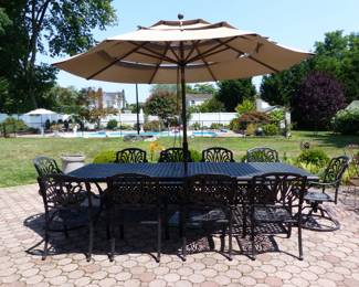 Outdoor large cast aluminum dining table with 10 chairs & umbrella