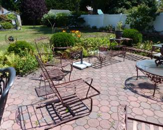 Many pieces of vintage Woodard wrought iron furniture, all with new cushions