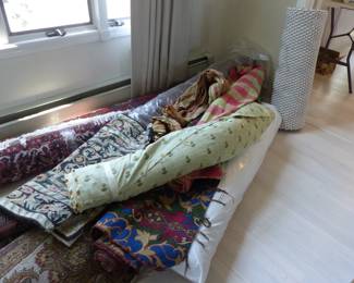 Sarouk and other area rugs, fabric bolts