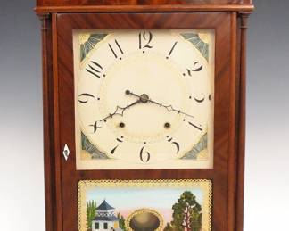 A 19th century Eli Terry & Sons Pillar & Scroll mantel clock.  30 hr weight driven wooden time and strike movement with painted wooden dial and Roman numerals.  Mahogany case with scrolled swans neck crest and brass finials above a single door with square dial glass and reverse painted lower with gilded detail flanked by delicate turned columns on a molded base with scrolled cutout and tall feet.  Paper label 50% intact.  Older refinishing with good color, small repair and minor dial touch-up, older replaced center finial, running when cataloged.  31 1/4" high overall.  ESTIMATE $800-1,200