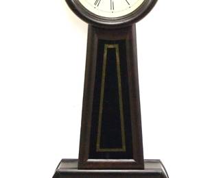 A 19th century American Banjo clock.  8-day weight driven time and strike movement with painted iron dial and Roman numeral, subsidiary seconds.  Grain painted hardwood case with circular molded dial door above a tapered throat panel and shaped lower door, both with reverse painted glass with gilded detail.  Older refinishing with minor wear, re-painted dial and restored lower glasses, running when cataloged.  39 1/4" high.  ESTIMATE $400-600