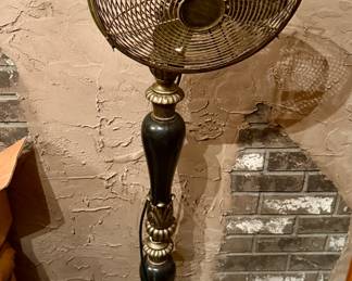 Decorative gold and black tone standing fan