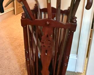 Vintage wood umbrella stand with brass handled canes