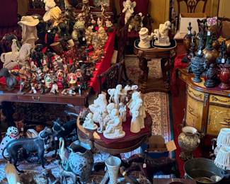 An entire room of vintage collectibles including statuary, figurines, vases and urns