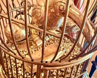 Brass parrot inside cage