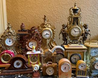 Large assortment of vintage desk featuring several Imperial mantle clocks