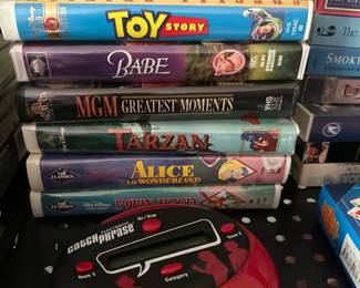 Various VHS tapes and games