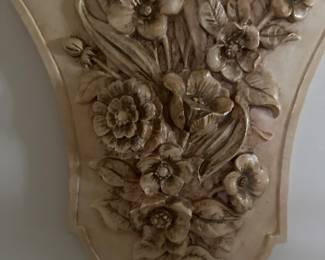 collectible wall plaque featuring a floral design
