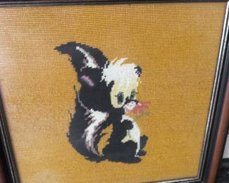 Frame skunk needlepoint