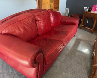 Well used large couch, suitable for a family room.