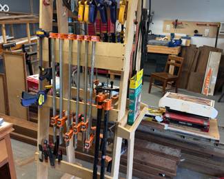 Hand-made clamp rack with clamps of various sizes.