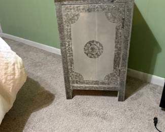 Intricate side table with embossed metal