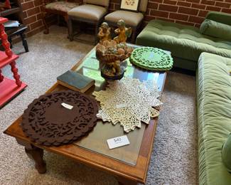 Coffee table with glass top and decorative items