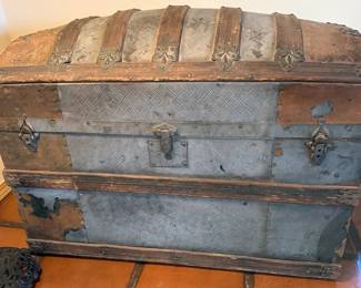 Multiple vintage wooden travel trunks