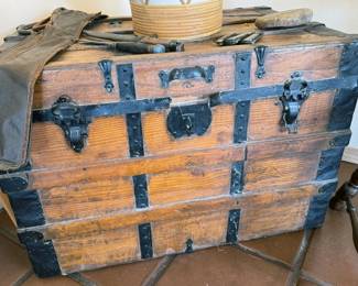 Multiple vintage wooden travel trunks