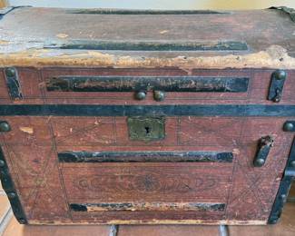 Multiple vintage wooden travel trunks