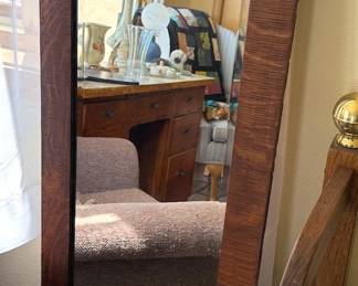 Multiple wood framed mirrors in different styles