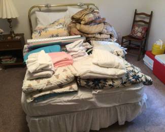 Twin bed with mattress.  Sheets, towels and misc linens