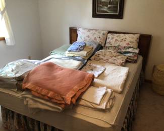 Queen bed with mattress.  Blankets, sheets