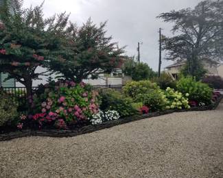 Stacked slate; annuals & perennials; hydrangeas; crape myrtle