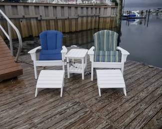 Polyresin Adirondack chairs by Seaside Casual with footrests & accent table