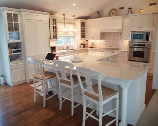 Ample upper and lower kitchen cabinets by Brookhaven