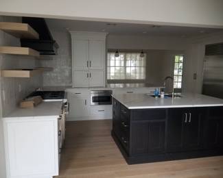 U-shaped kitchen with island, peninsula & wet bar. Cabinetry by CABICO