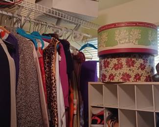 lots of ladies clothes and hats