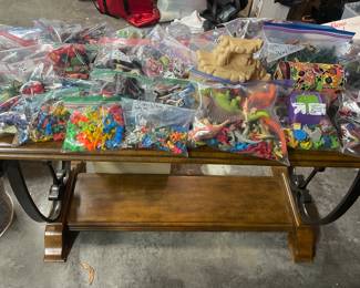 Tiny toy sets and wood and glass table
