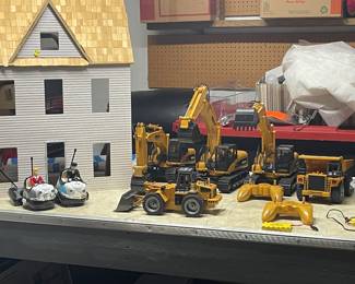 Unfinished dollhouse, remote control vehicles